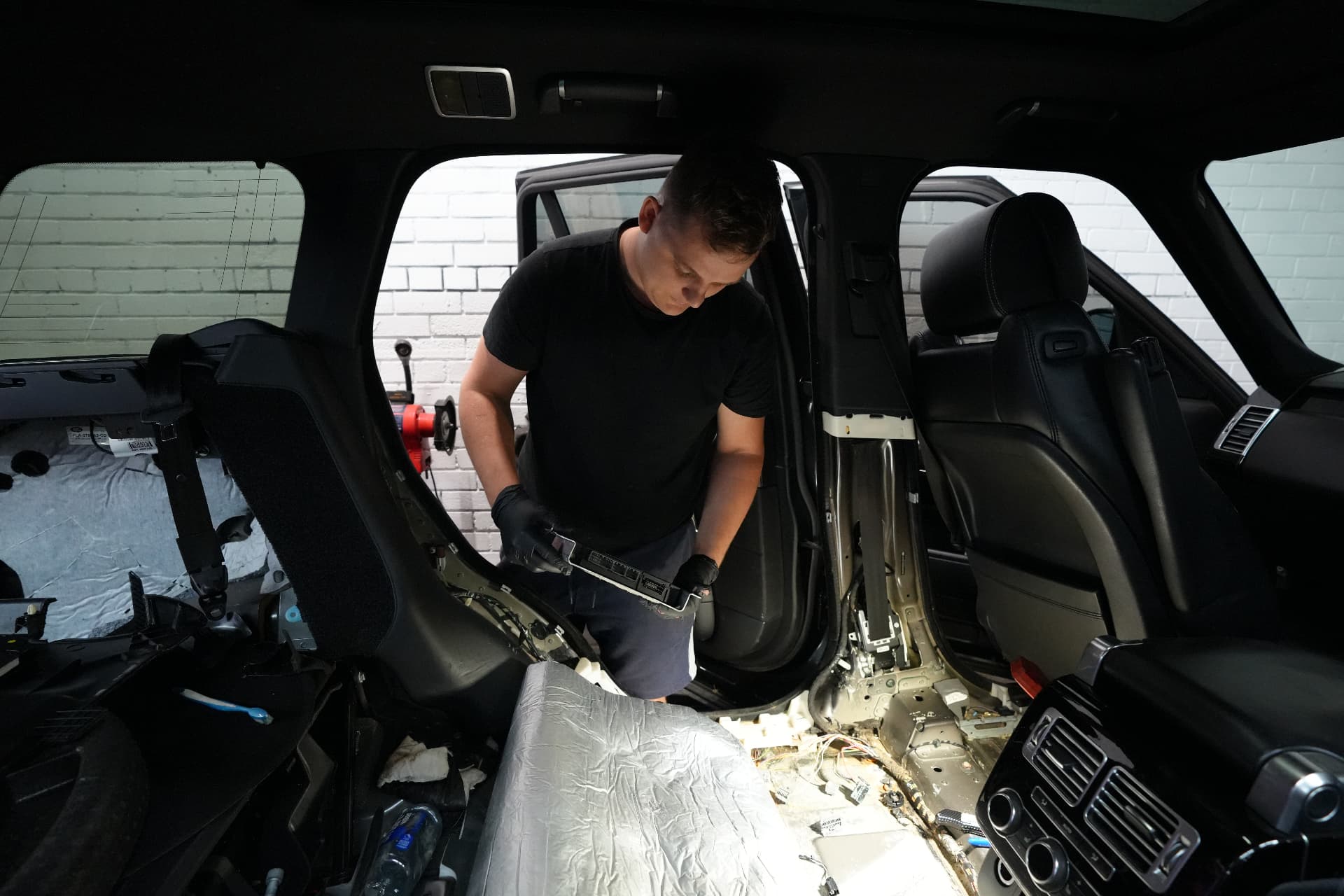 Mechanic inspecting a removed control module