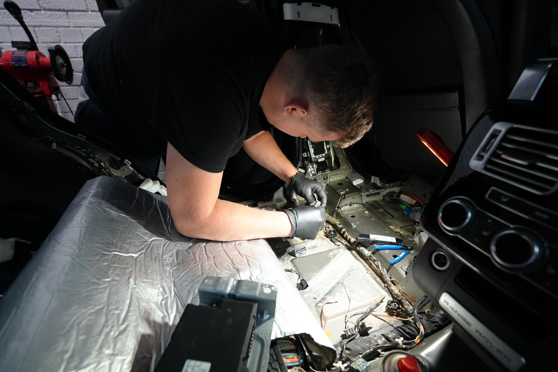 ProUK Garage auto electrician repairing a wiring harness