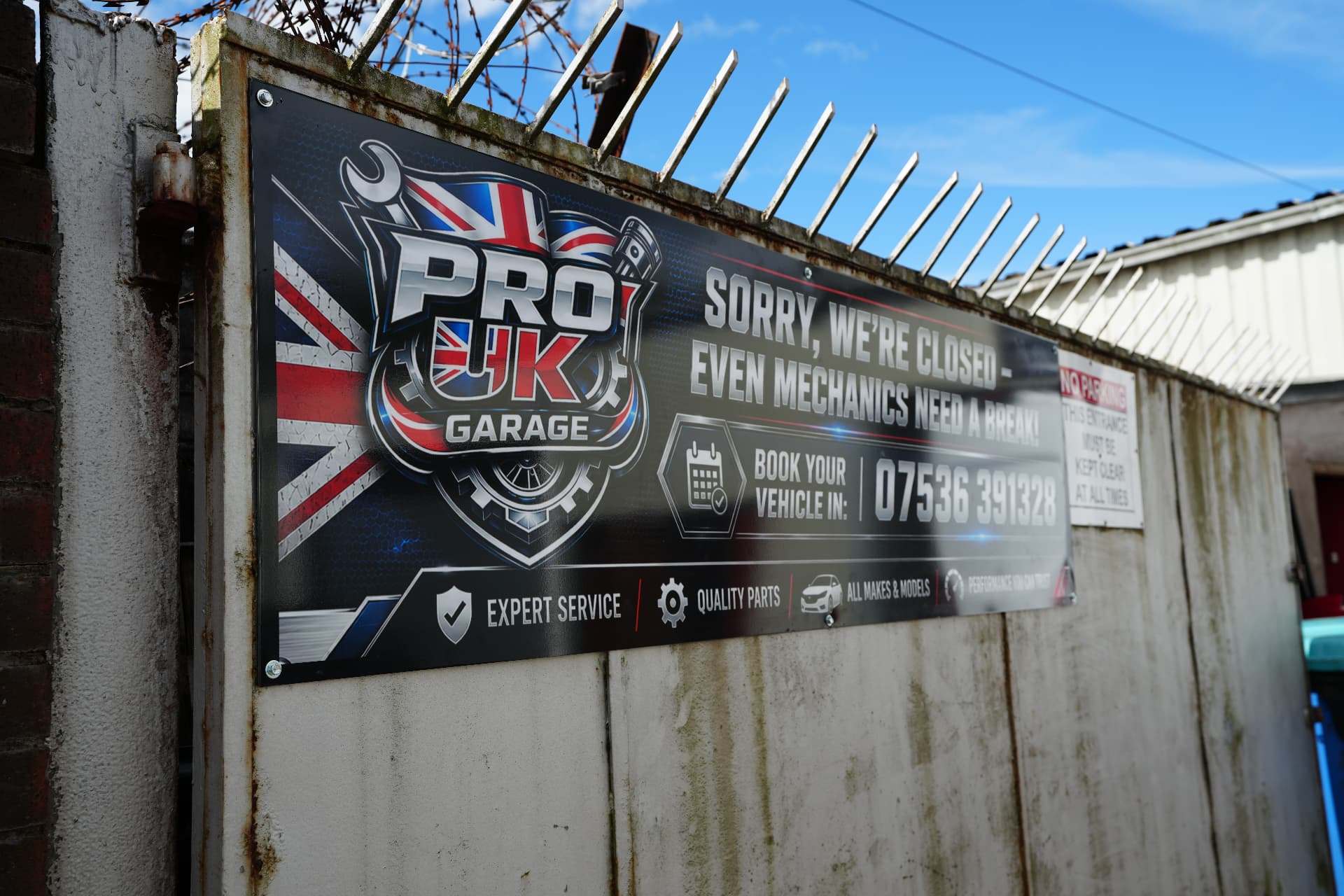 ProUK Garage sign at the workshop entrance in Rochdale