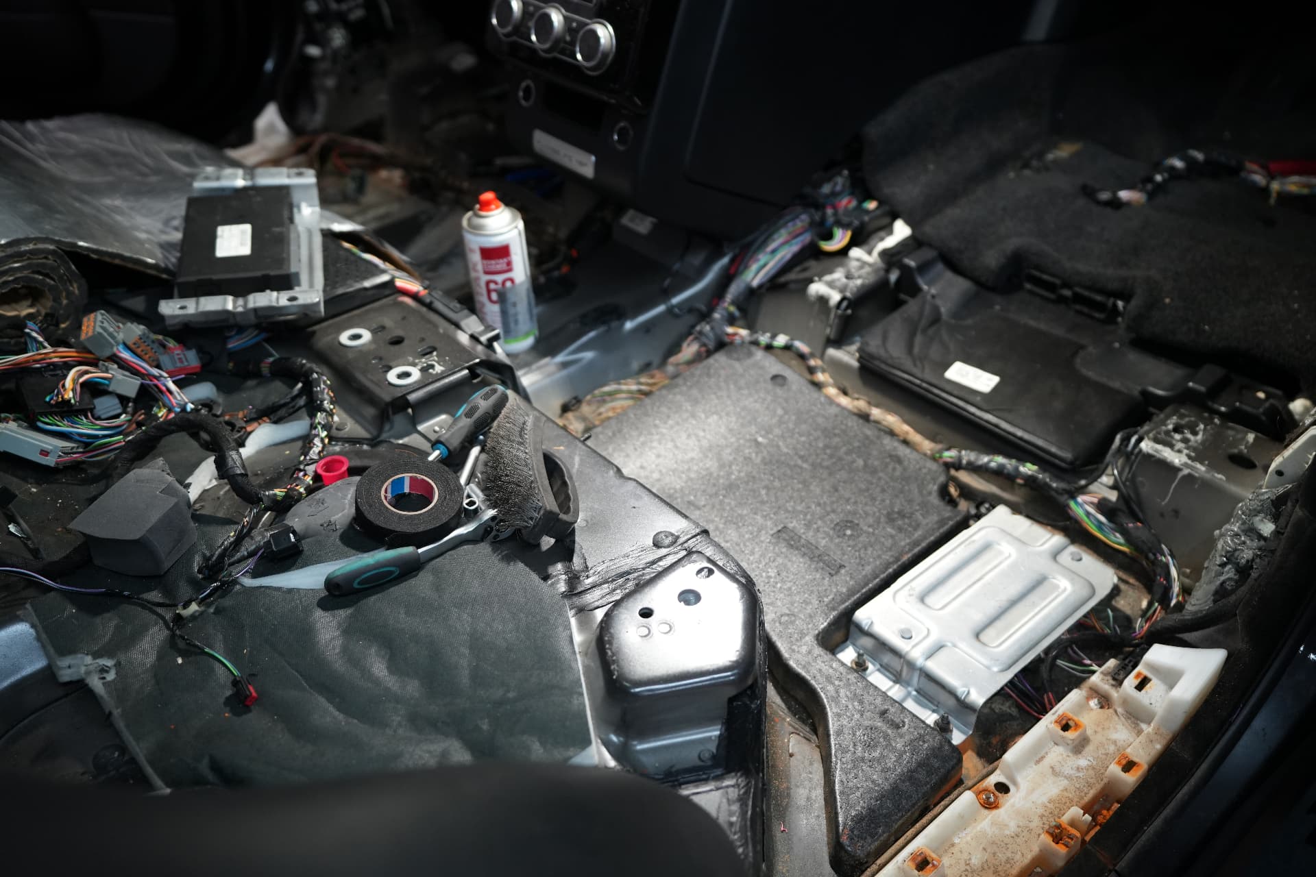 Burnt wiring loom and floor pan during auto electrics repair