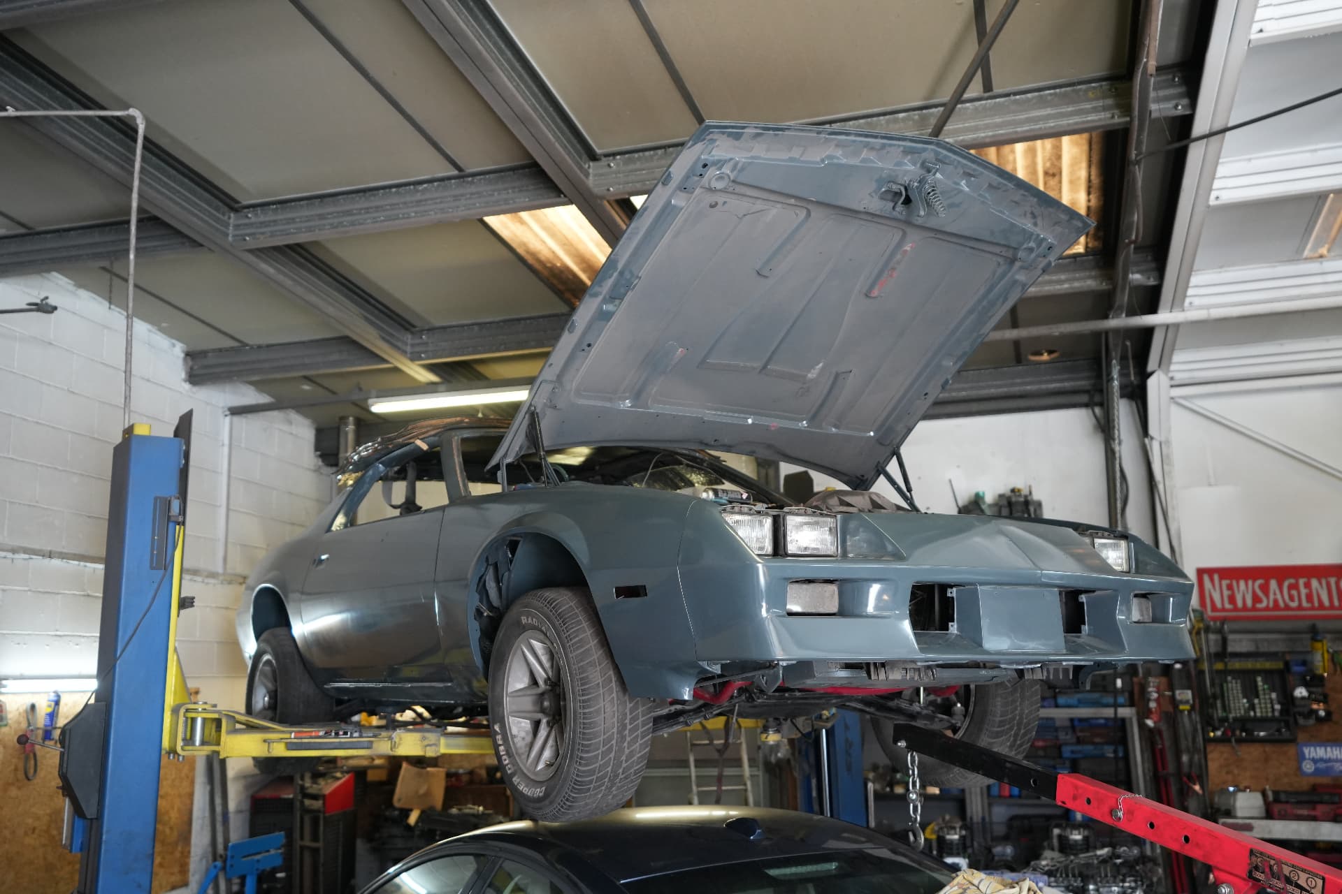 Classic Camaro on the two-post lift during repair work